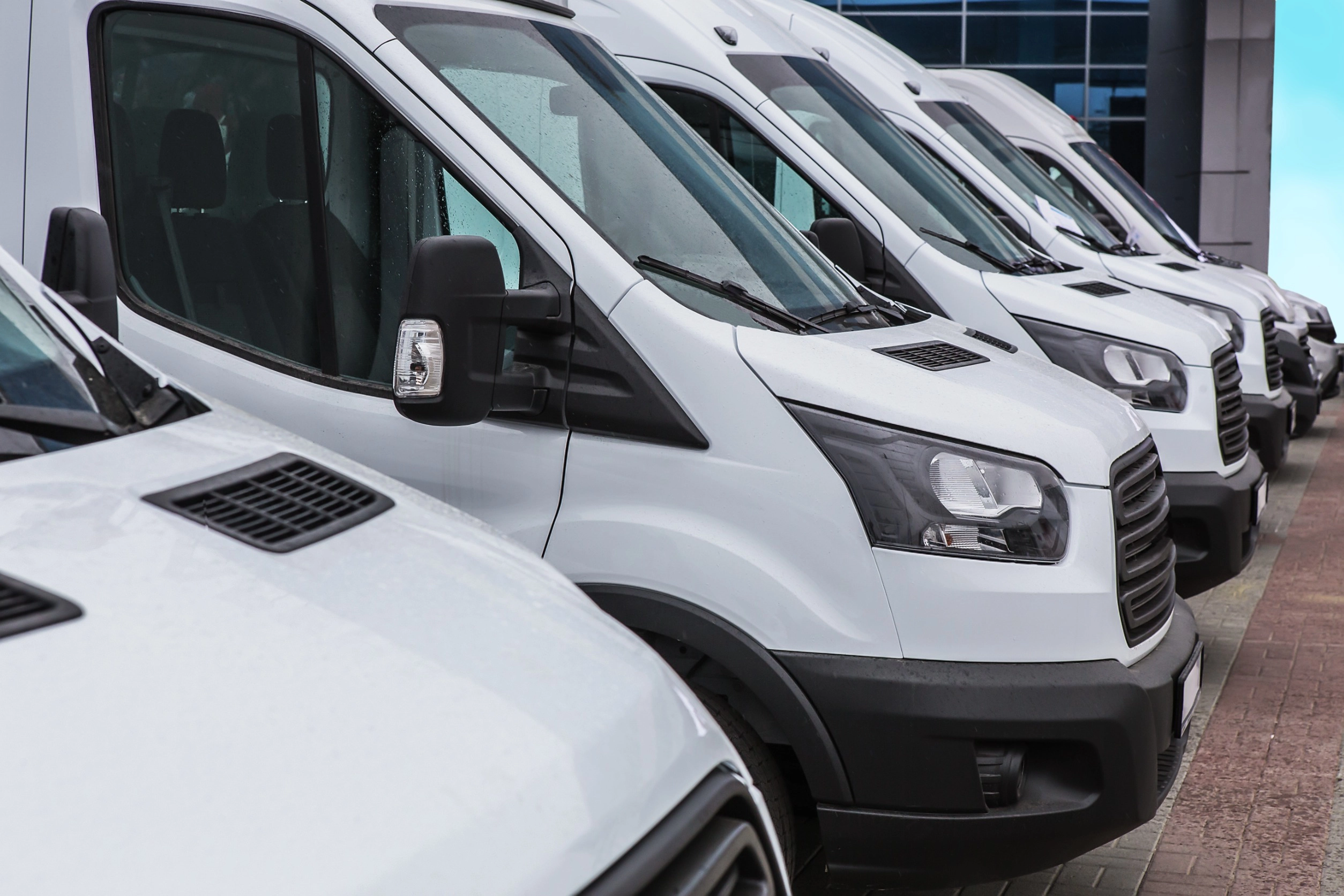 Fleet Services. White Sprinter Vans Lined Up In A Row.